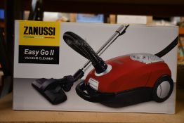 A new Zanussi Easy Go ll Red 3L, 700W, 7.5M radius retractable cord vacuum cleaner.