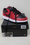 A pair of youths as new Nike Air Jordan 1 Low (UK 6).