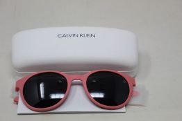 A pair of as new Calvin Klein sunglasses.