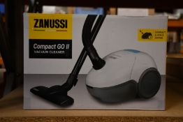 A new Zanussi Compact Go ll White, 750W, 1.5L, 5M automatic cord rewind vacuum cleaner.