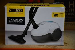 A new Zanussi Compact Go ll White, 750W, 1.5L, 5M automatic cord rewind vacuum cleaner.