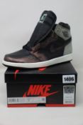 A pair of as new Nike Air Jordan 1 High OG (UK 7).
