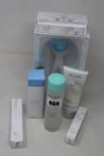 An as new Nu Skin Lumispa and six Nu Skin beauty products to include activating cleanser, makeup
