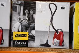 A new Zanussi Easy Go ll Red 3L, 700W, 7.5M radius retractable cord vacuum cleaner.