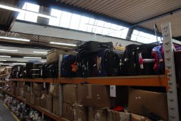 A quantity of empty suitcases/holdalls (Approximately 50 items).