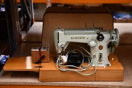 A pre-owned Singer sewing machine.