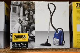 A new Zanussi Easy Go ll Blue 3L, 700W, 7.5M radius retractable cord vacuum cleaner.