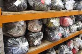 Twelve bags of pre-owned clothing and related items.