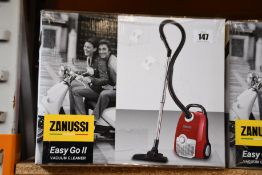 A new Zanussi Easy Go ll Red 3L, 700W, 7.5M radius retractable cord vacuum cleaner.