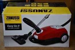 A new Zanussi Easy Go ll Red 3L, 700W, 7.5M radius retractable cord vacuum cleaner.