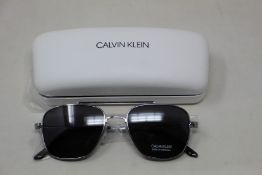A pair of as new Calvin Klein sunglasses.