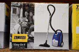 A new Zanussi Easy Go ll Blue 3L, 700W, 7.5M radius retractable cord vacuum cleaner.