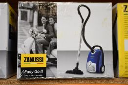 A new Zanussi Easy Go ll Blue 3L, 700W, 7.5M radius retractable cord vacuum cleaner.