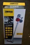 A new Zanussi Airwave Red cordless rechargeable 130W, 1Ltr 3 in 1 hand stick vacuum cleaner (ZHS-