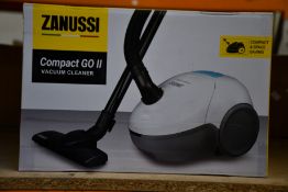 A new Zanussi Compact Go ll White, 750W, 1.5L, 5M automatic cord rewind vacuum cleaner.