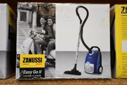A new Zanussi Easy Go ll Blue 3L, 700W, 7.5M radius retractable cord vacuum cleaner.