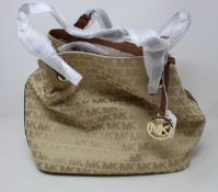 An as new Michael Kors Jet Set logo tote bag.