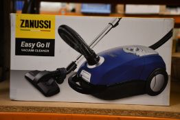 A new Zanussi Easy Go ll Blue 3L, 700W, 7.5M radius retractable cord vacuum cleaner.