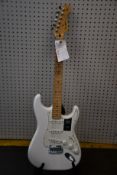 A Fender Player Stratocaster MN guitar in Polar White (Chip paintwork to back/side of the guitar).