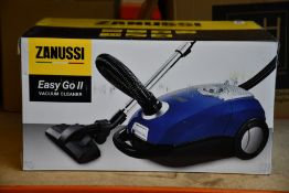 A new Zanussi Easy Go ll Blue 3L, 700W, 7.5M radius retractable cord vacuum cleaner.