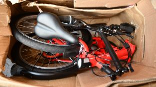 A pre-owned BTwin Tilt 120 folding bike (Some visible damage, item untested, viewing advised).