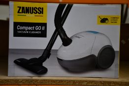 A new Zanussi Compact Go ll White, 750W, 1.5L, 5M automatic cord rewind vacuum cleaner.
