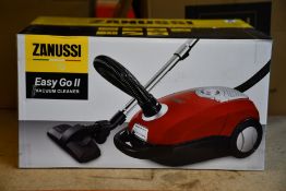 A new Zanussi Easy Go ll Red 3L, 700W, 7.5M radius retractable cord vacuum cleaner.