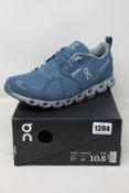 A pair of as new On Running Cloud waterproof trainers (UK 10).