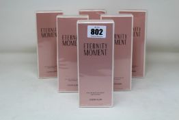 Six boxed as new Eternity Moment eau de parfum (100ml).