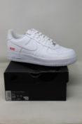 A pair of as new Nike X Supreme Air Force 1 Low (UK 9).