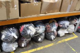 Twelve bags of pre-owned clothing and related items.
