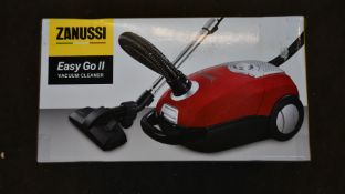 A new Zanussi Easy Go ll Red 3L, 700W, 7.5M radius retractable cord vacuum cleaner.