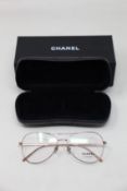 A pair of as new Chanel glasses frames.