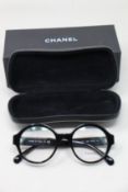 A pair of as new Chanel glasses frames.