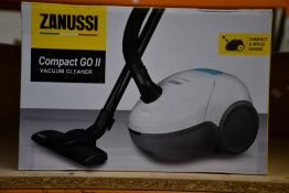 A new Zanussi Compact Go ll White, 750W, 1.5L, 5M automatic cord rewind vacuum cleaner.