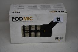 A boxed as new Rode PodMic dynamic microphone.