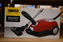 A new Zanussi Easy Go ll Red 3L, 700W, 7.5M radius retractable cord vacuum cleaner.