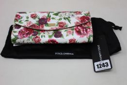 An as new Dolce & Gabbana floral clutch.