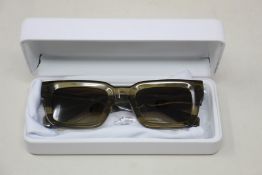 A pair of Chimi 05 Green sunglasses.