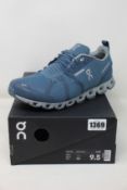 A pair of as new On Running Cloud waterproof trainers (UK 9).