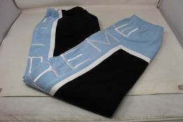 A pair of as new Supreme panelled sweatpants (M).