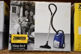 A new Zanussi Easy Go ll Blue 3L, 700W, 7.5M radius retractable cord vacuum cleaner.