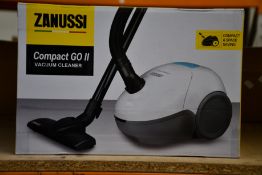 A new Zanussi Compact Go ll White, 750W, 1.5L, 5M automatic cord rewind vacuum cleaner.