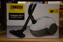 A new Zanussi Compact Go ll White, 750W, 1.5L, 5M automatic cord rewind vacuum cleaner.