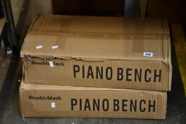 Two boxed as new Doubleblack piano benches in black.