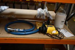 A pre-owned Lutz MI 4 Drum Pump Set (Some damage to handle).