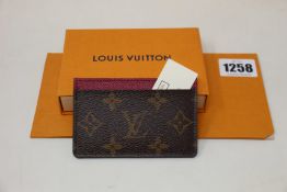 An as new Louis Vuitton leather card holder.