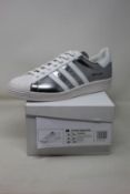 A pair of as new Prada Adidas Superstar sneakers (UK 9.5).