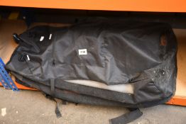 A pre-owned unbranded inflatable paddle board with pump and paddles (Item untested).