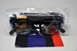 A pair of as new Anne & Valentin glasses frames with case.